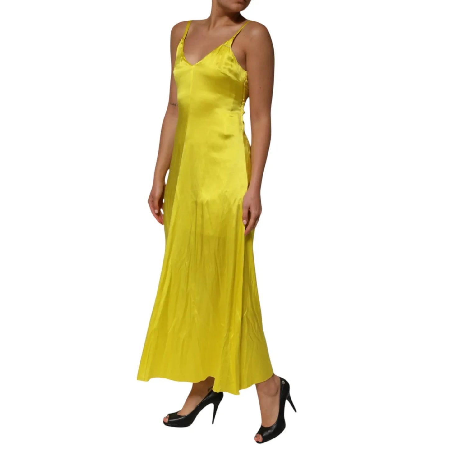 Woman wearing Tonello Yellow Silk Satin Slip Maxi Spaghetti Strap Maxi Dress, featuring V-neckline and elegant silhouette.