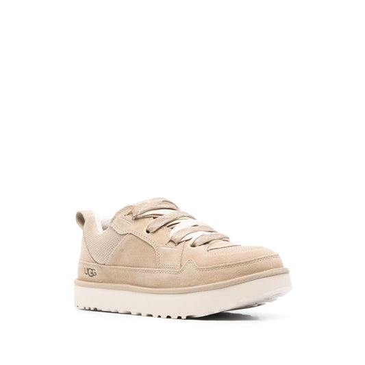 UGG Australia Sneakers Beige with lace-up front, pull-tab, rubber sole, and debossed logo, ideal for style and comfort.