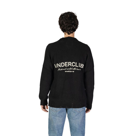 Back view of Underclub Black Cotton Cardigan with ribbed texture and bold text on back, worn by a male model with blue jeans.