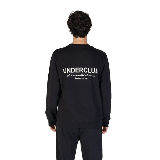 Back view of model wearing Underclub Black Cotton Sweatshirt with logo, showcasing its comfortable regular fit and minimalist design.