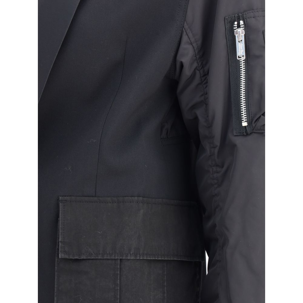 Undercover Black Polyester Bomber with zippered sleeve pocket and ribbed cuffs, combining blazer structure with bomber jacket details