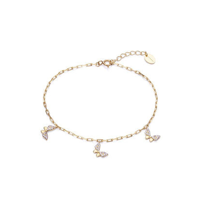 Delicate gold bracelet with butterfly charms, ideal for stylish accessorizing.
