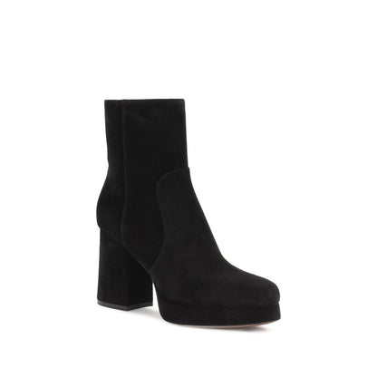 Valentino Garavani Black Calf Leather Bos Taurus Ankle Boots with wide heel and platform, featuring VLogo detail and side zipper closure.