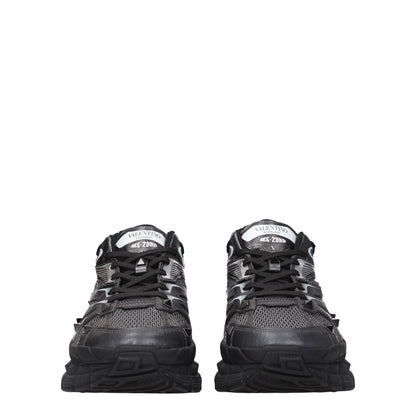 Valentino Garavani Black Fabric Athletic Sneakers, leather lace-up with studs, logos front and back, round toe, mid-heel rubber sole.
