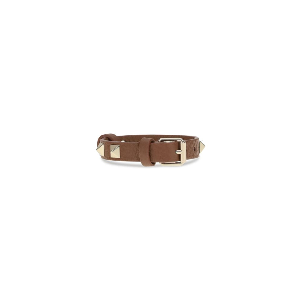 Valentino Garavani Brown Metal Bracelet with leather design, iconic studs, and adjustable buckle, showcasing rock-chic style and quality.