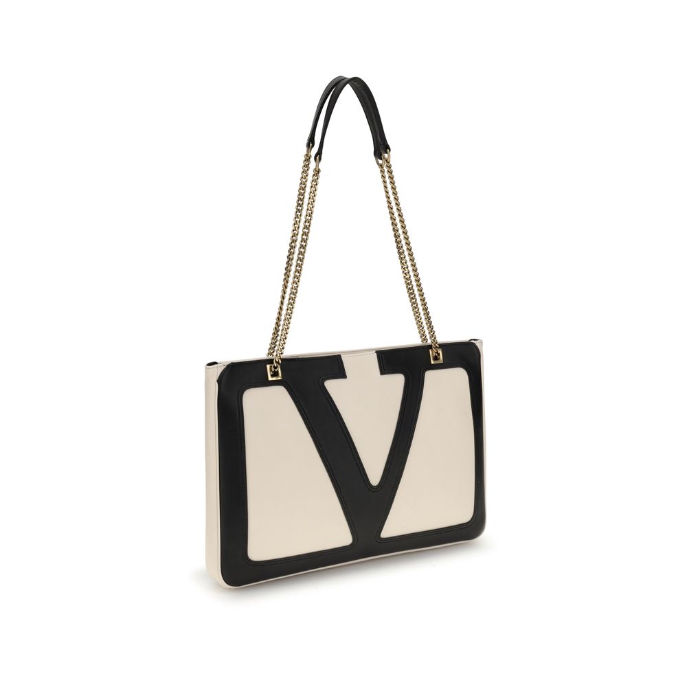 Valentino Garavani Cream Calf Leather Bos Taurus Shoulder Bag with VLogo, chain handles, and elegant design.