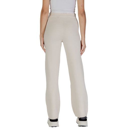 Back view of woman wearing Vero Moda Cream Viscose Pant showcasing the elegant wide-leg palazzo style.