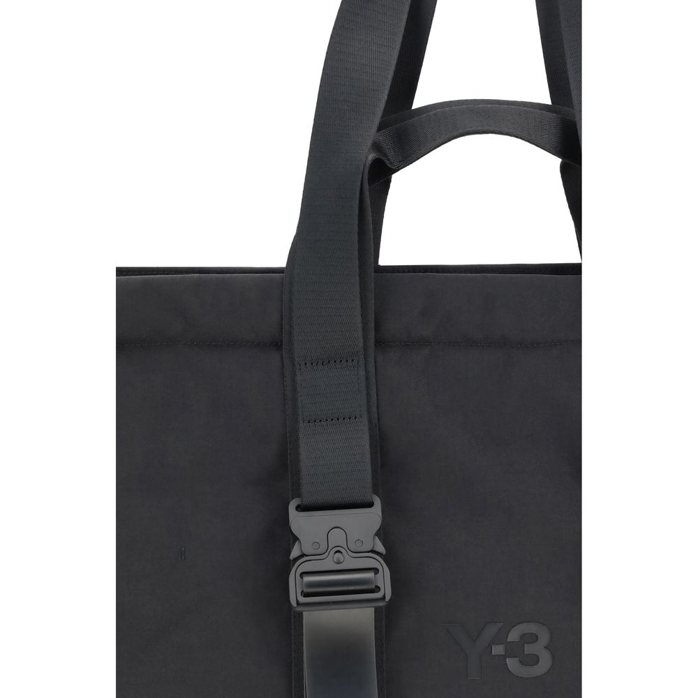 Close-up of Y-3 Black Nylon Shoulder Bag with top handles and tone-on-tone front logo. Practical design with ample space and security.